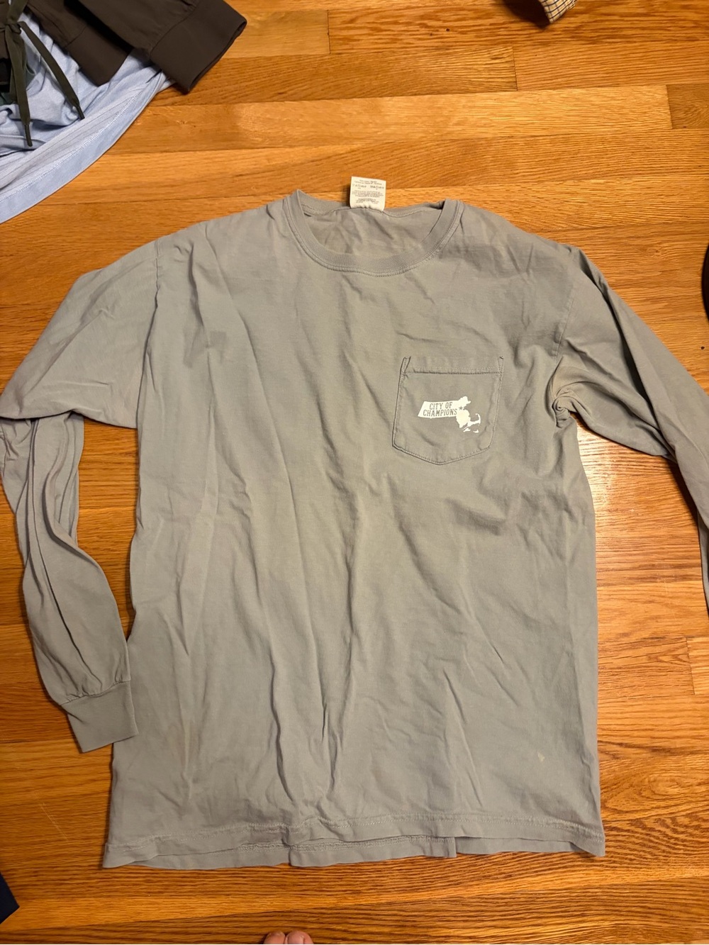 Men's Long-Sleeve Pocket Tee in Light Gray with Subtle Logo